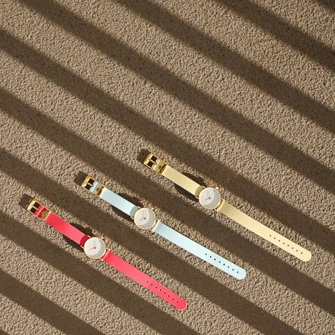 Montre femme rose flash / crème et or