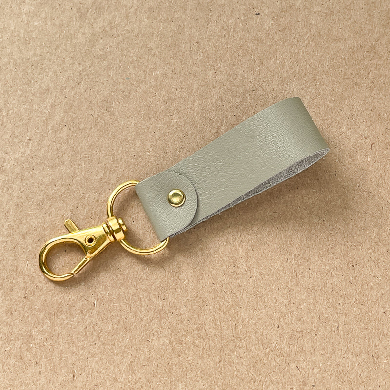 Porte-clé gris - or