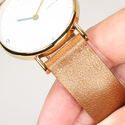 Beige / white and gold watch