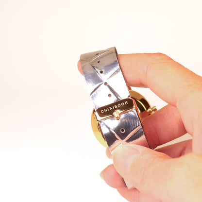 Dark brown / white and gold watch