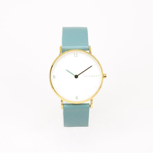 Montre turquoise / blanc et or