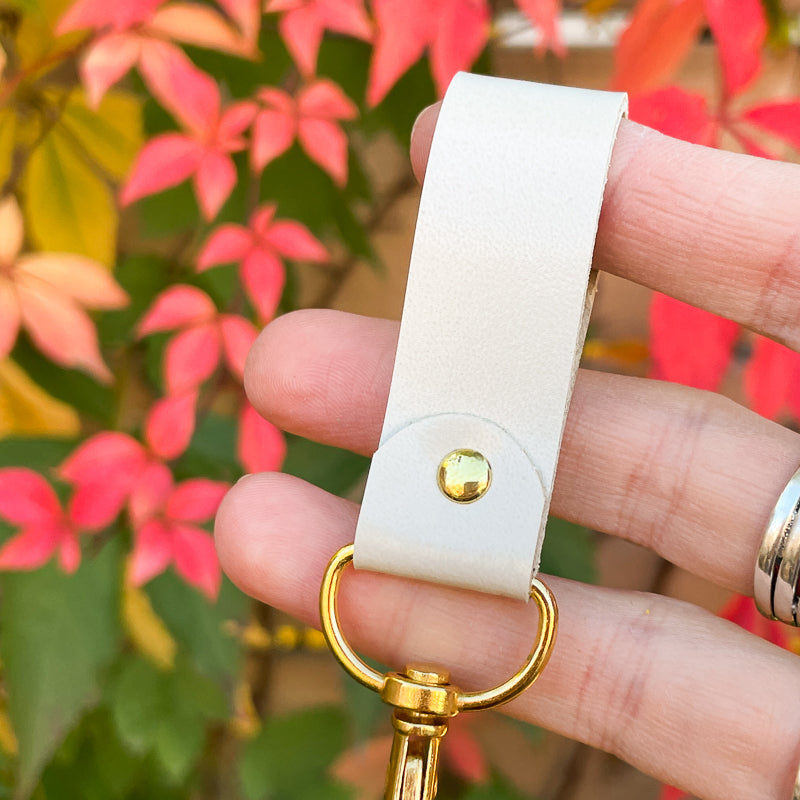 Porte-clé beige lustré - or