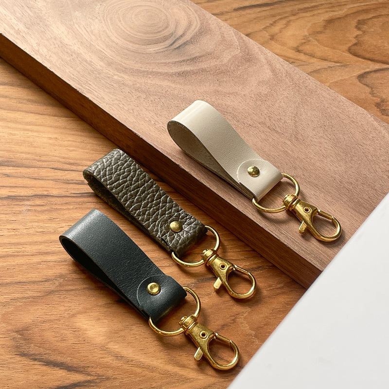 Porte-clé beige lustré - or